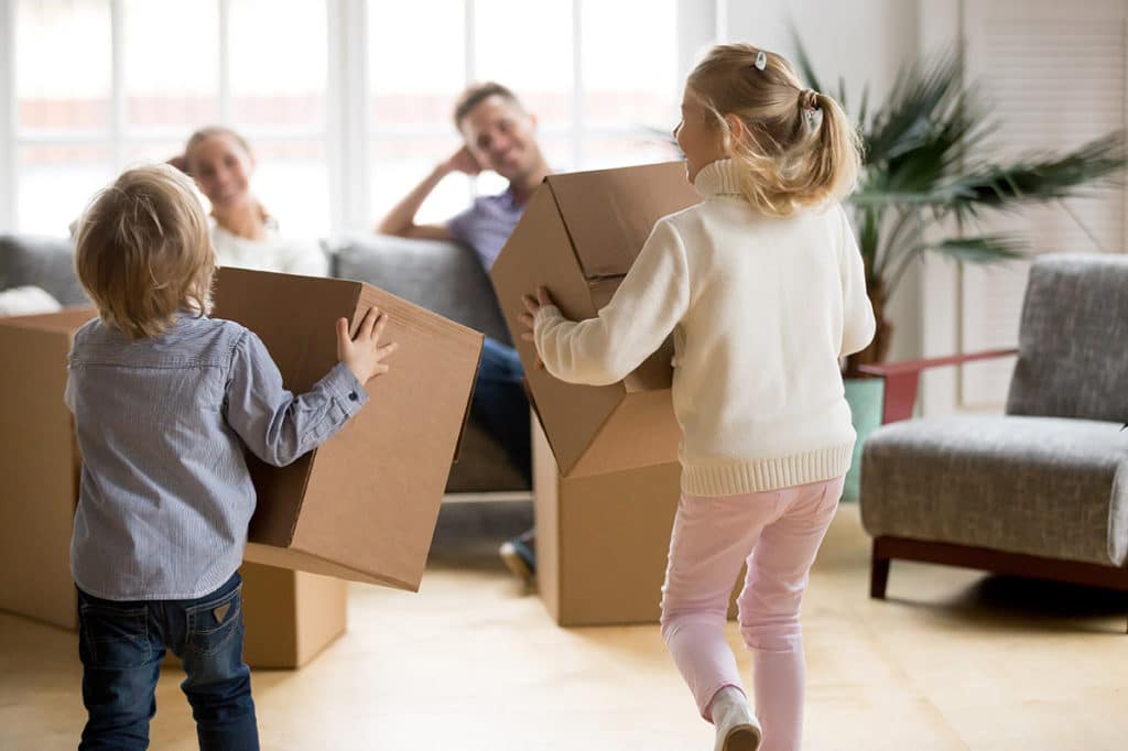 Kids playing with cardboard boxes