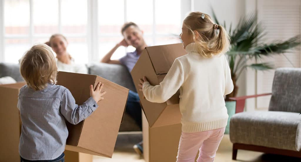 Kids playing with cardboard boxes